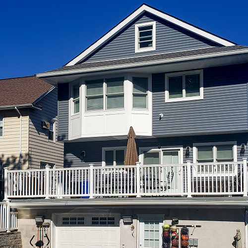 Renovated home facade after full siding replacement by expert team